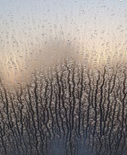 Full frame shot of wet glass window