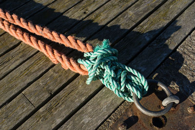 High angle view of rope tied up to metal