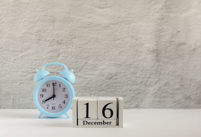 Close-up of clock on wall