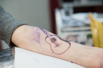 Close-up of woman hand with tattoo