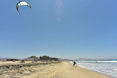 Scenic view of beach against clear sky