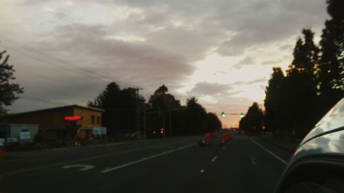 View of road against cloudy sky