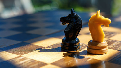 Close-up of chess pieces on table