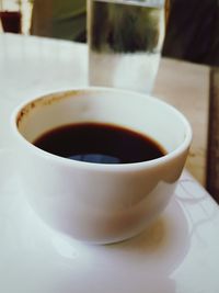 Close-up of coffee cup on table