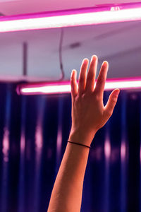 Close-up of woman hand holding illuminated light