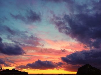 Low angle view of dramatic sky during sunset