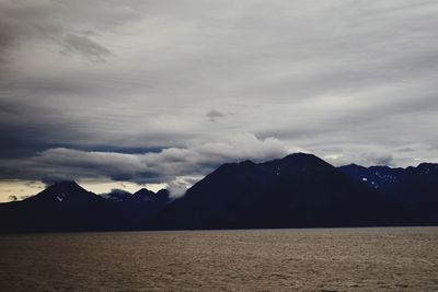 Scenic view of silhouette mountains against sky