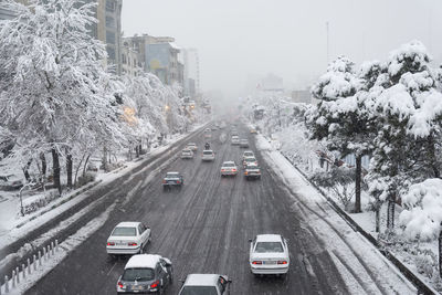 High angle view of vehicles on road in winter