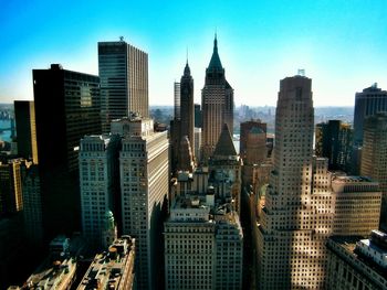 Modern cityscape against blue sky