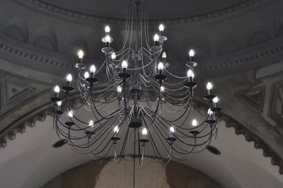 Low angle view of illuminated chandelier