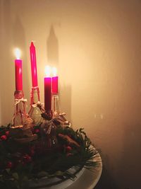 Close-up of tea light candles on table