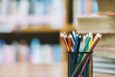 Close-up of colored pencils on table