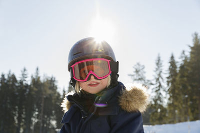 Smiling girl waring ski goggles