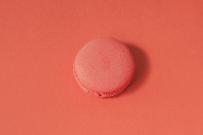 Close-up of red cake against white background