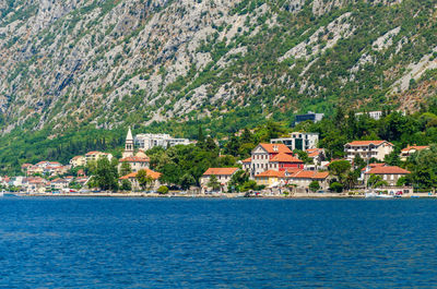 Small mediterranean town of dobrota, in the bay of kotor shot from the sea