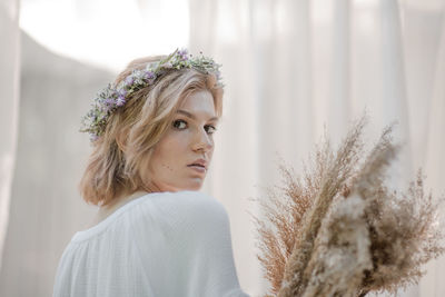 Portrait of young woman looking away