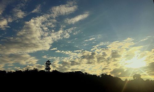 Low angle view of silhouette person against sky during sunset