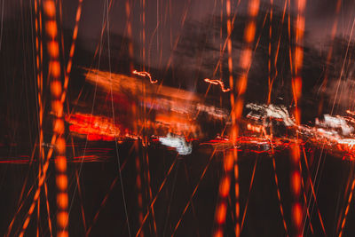 Reflection of illuminated lights on water at night