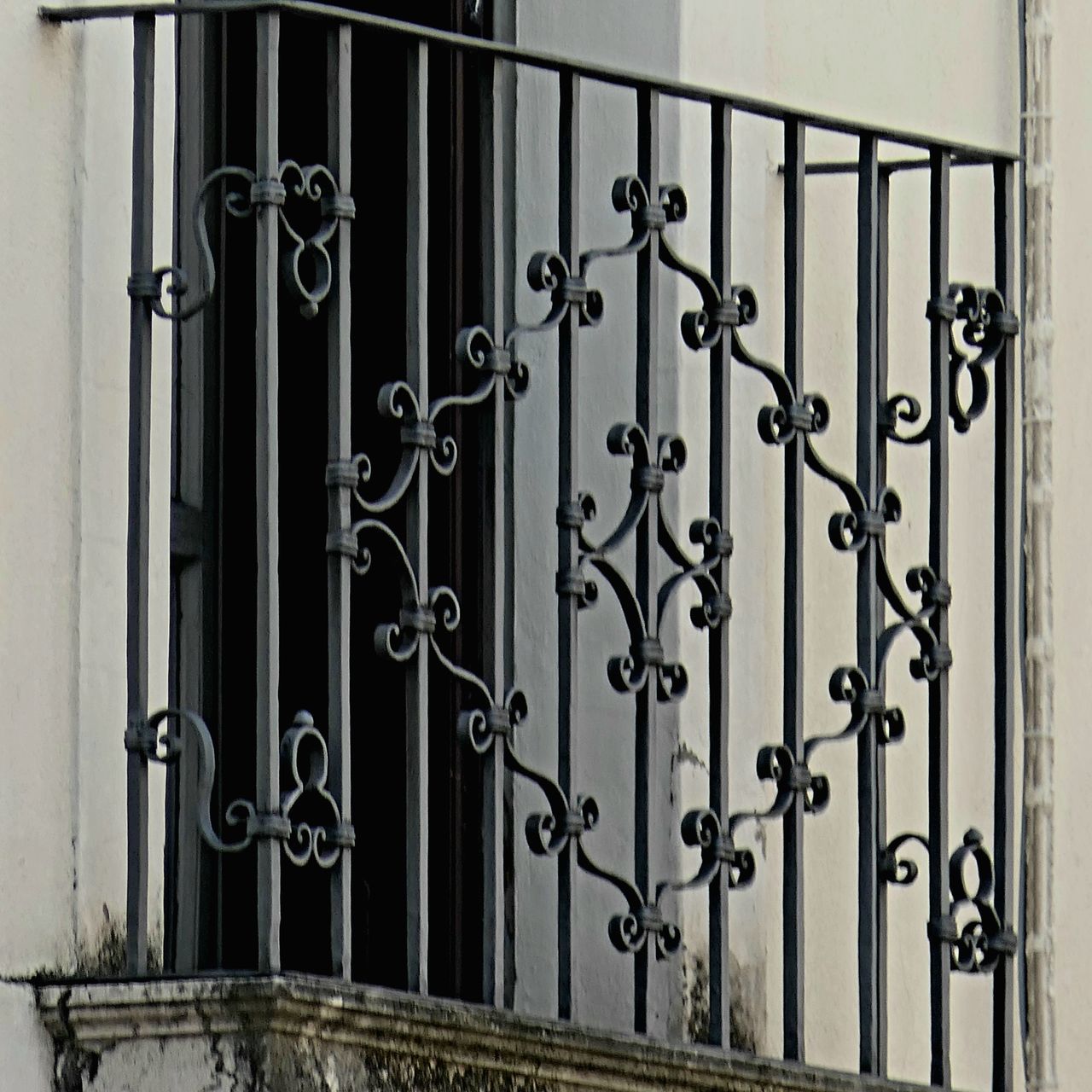 iron, architecture, metal, security, closed, protection, wrought iron, gate, built structure, entrance, building exterior, building, no people, door, handrail, baluster, pattern, day, interior design, glass, wall, residential district, lock, house, railing, wall - building feature, outdoors