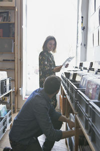 Young couple shopping for records together