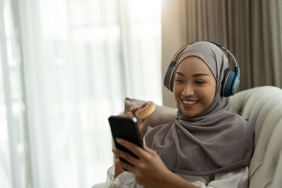 Young woman using mobile phone