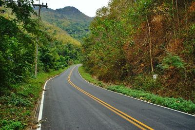 Empty road amidst mountains