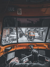 Man seen through car window