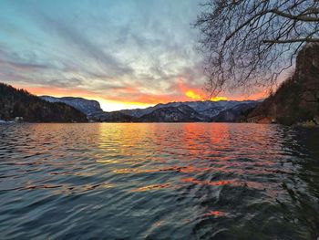 Scenic view of lake against sky during sunset