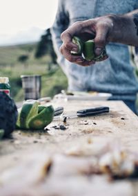 Close-up of man working food