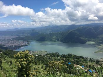 Scenic view of lake and mountains against sky