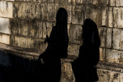 Shadow of people on wall