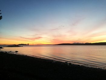 Scenic view of beach at sunset