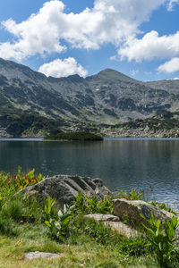 Scenic view of lake and mountains against sky