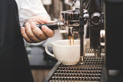 Hand holding coffee cup