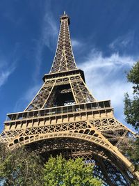 Low angle view of eiffel tower against blue sky