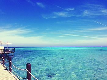 Scenic view of sea against blue sky