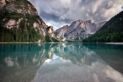 Scenic view of lake and mountains against sky