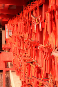 Close-up of red bell hanging in temple