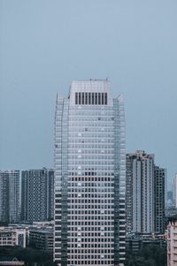 Low angle view of modern buildings against clear sky