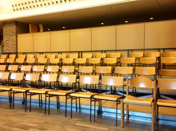 Chairs in empty illuminated auditorium