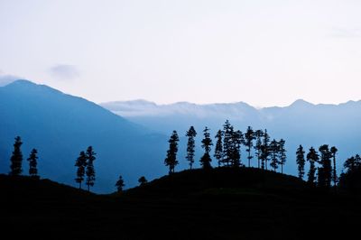 Scenic view of silhouette mountains against sky