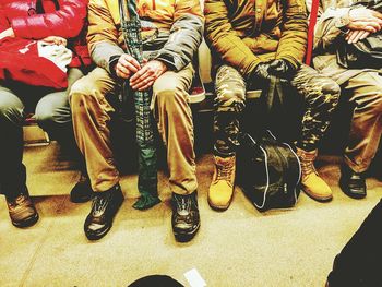 Low section of people on tiled floor