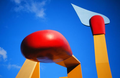 Low angle view of balloons against blue sky