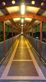 Illuminated walkway at subway station