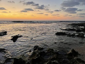 Scenic view of sea against sky during sunset