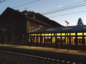 Railroad station platform against clear sky