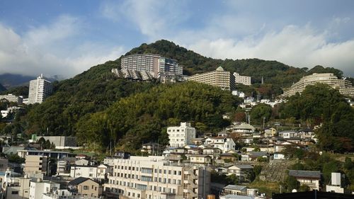 Buildings in city against sky