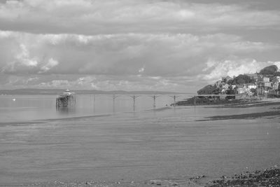 Panoramic photo of clevedon pier in somerset showing iron structure against blue sky