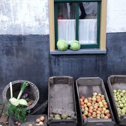 Fruits and vegetables on glass window