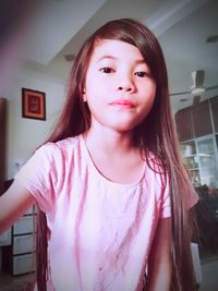Portrait of teenage girl at home